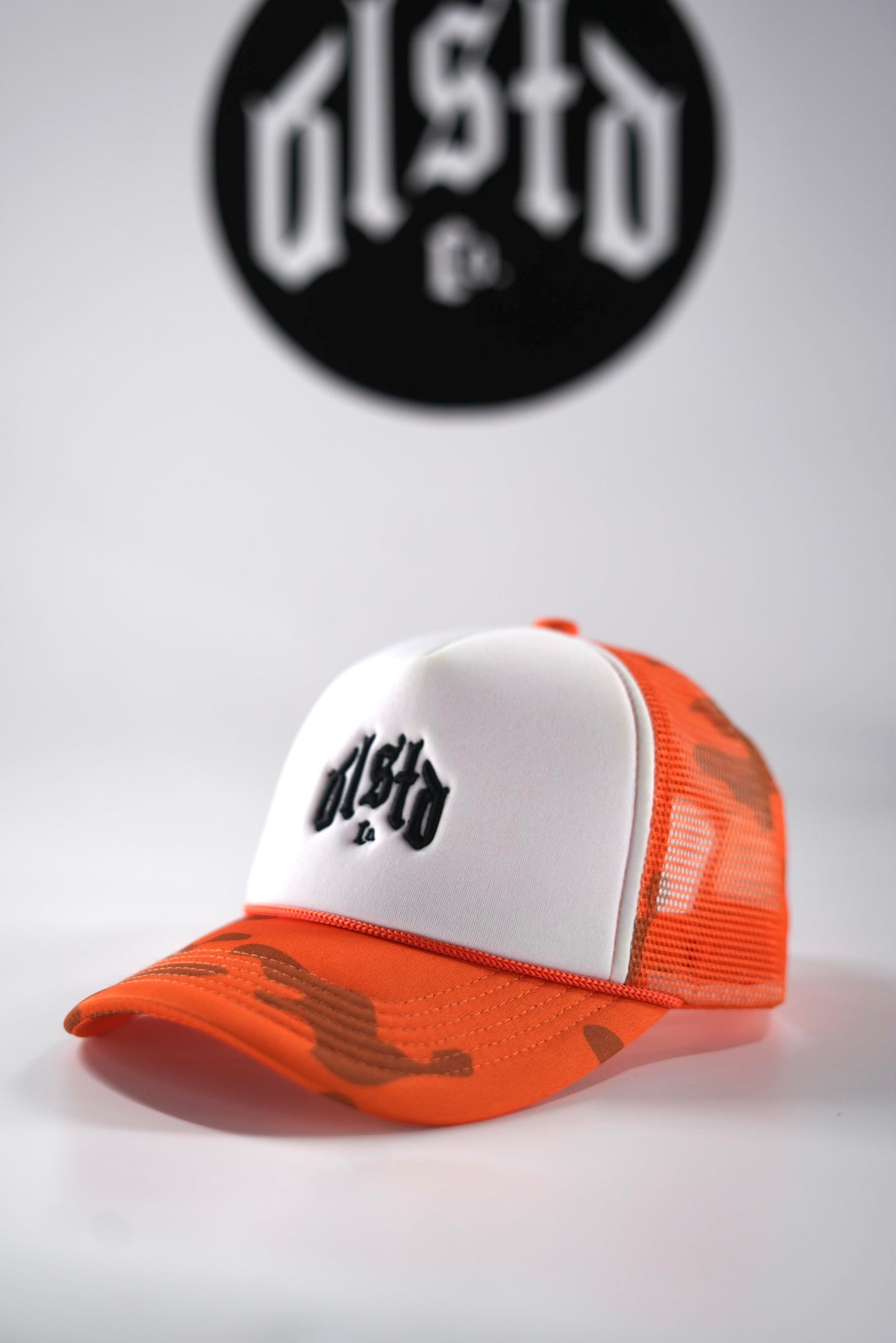 ORANGE CAMO TRUCKER HAT